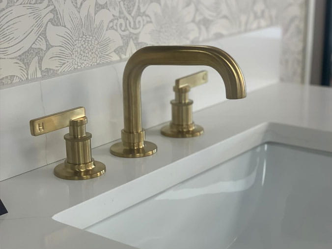 Closeup of a brass bathromo sink faucet