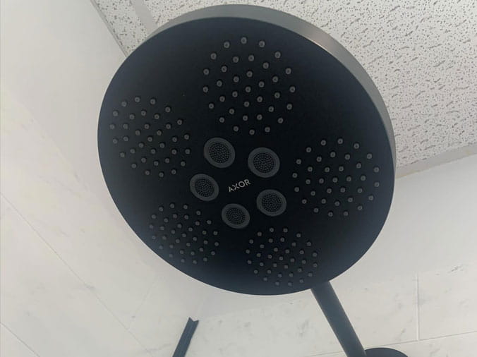 Closeup of a bklack shower head